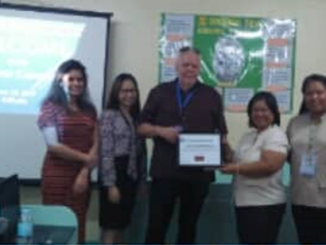 Picture of the Pacific Vision staff, Ms. Joy Kamacho and Mr. Barry Burgees with Mrs. Corazon Salvador and Ms. Larnie Lebuna of PNSB