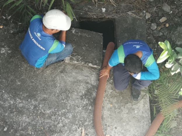 The images shows the Draining of the Septic Vault