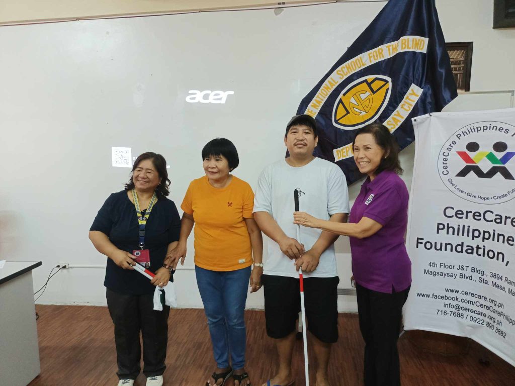 CereCare Staff handed White Cane to a Student